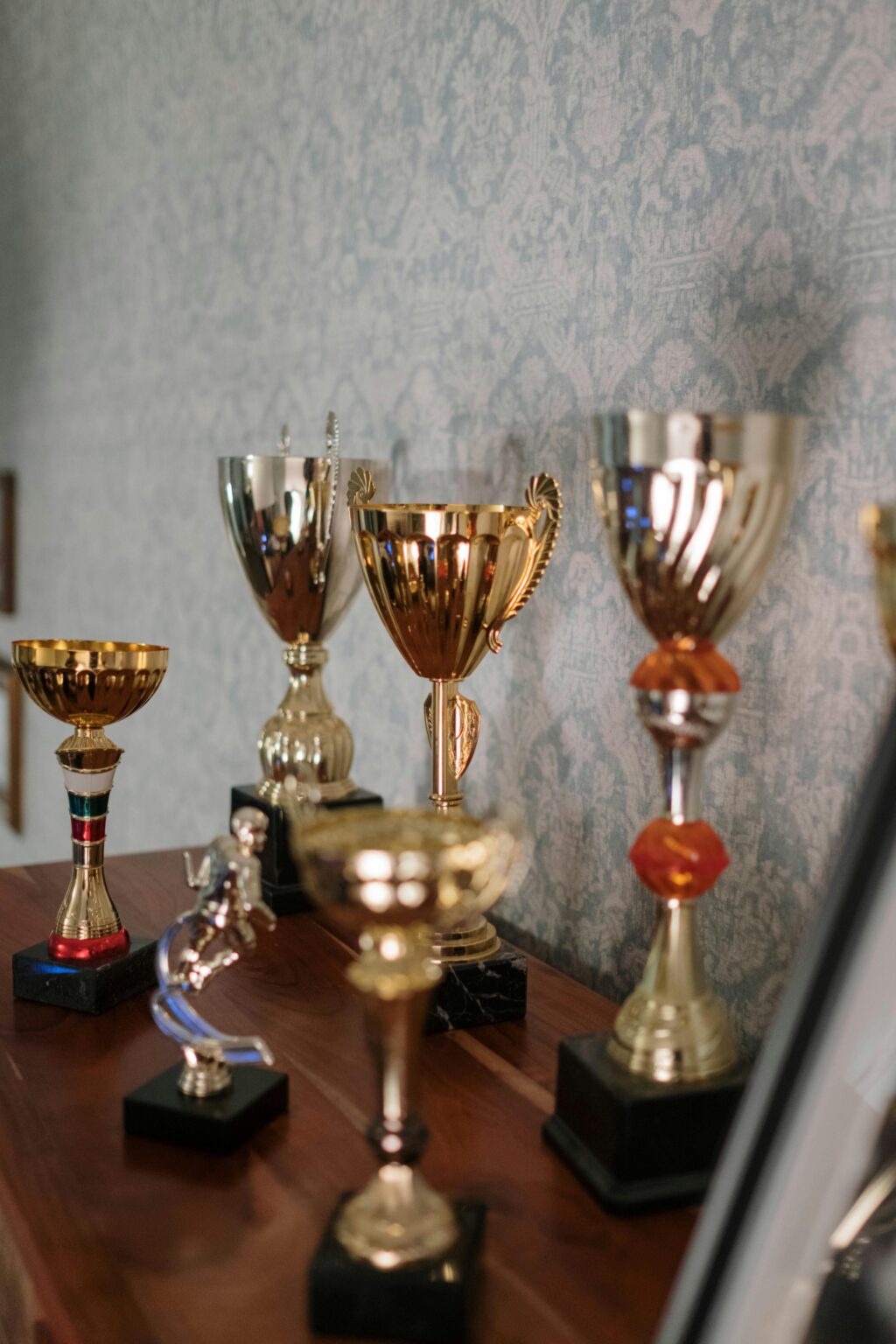 A collection of diverse trophies in a room, symbolizing success and achievement.